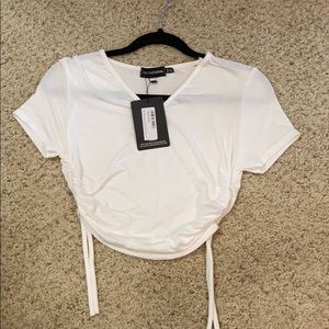 White scrunched side crop top